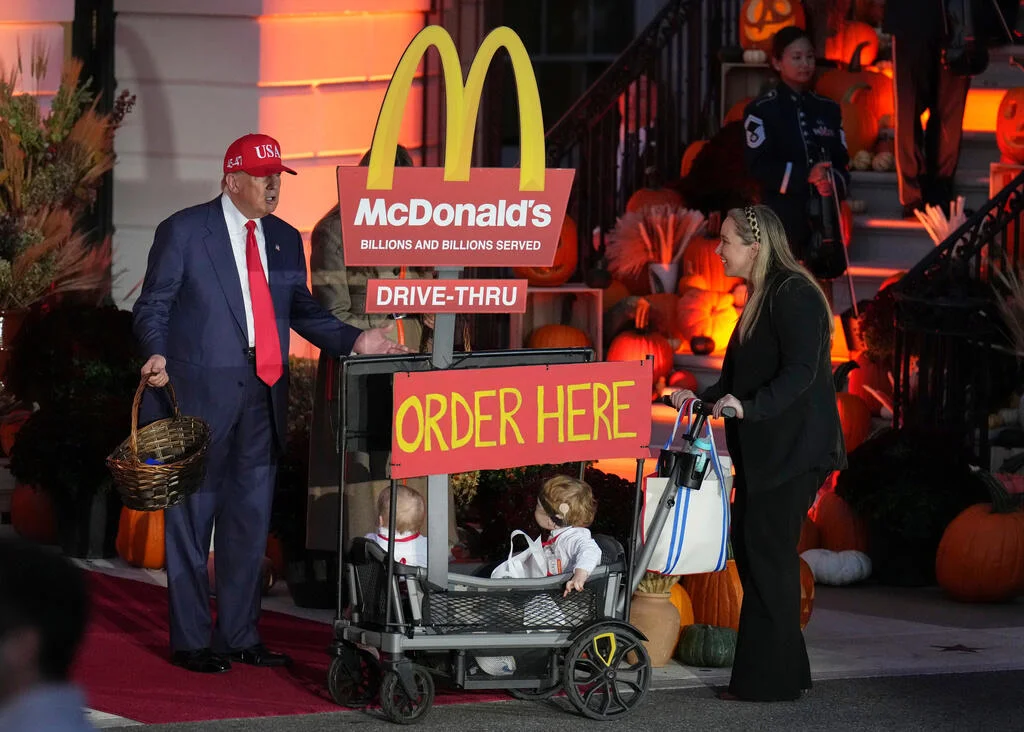 A group of trick-or-treaters come dressed as the president's favorite fast food joint.