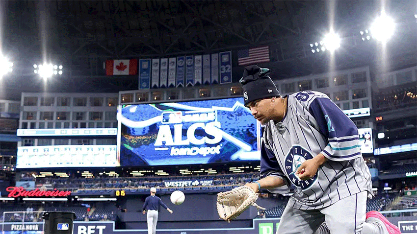 Josh Naylor #12 of the Seattle Mariners warms up before game one of the American League Championship Series against the Toronto Blue Jays at Rogers Centre on October 12, 2025 in Toronto, Ontario. 
