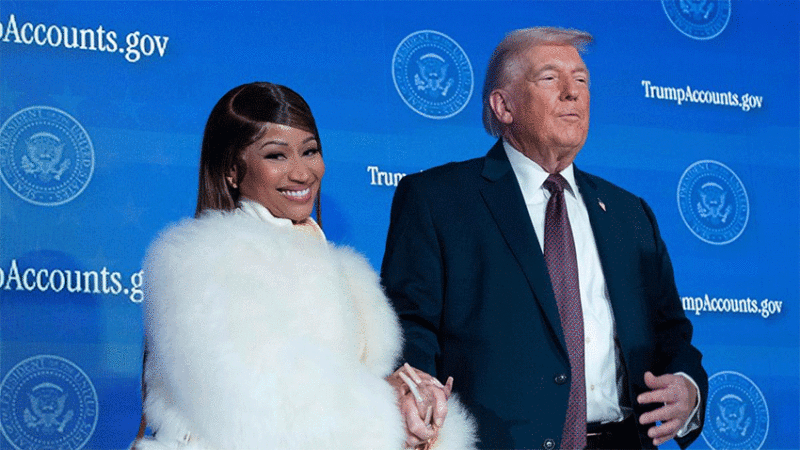 President Donald Trump greets Nicki Minaj on stage during the launch of a program known as Trump Accounts at the Andrew W. Mellon Auditorium, in Washington on January 28, 2026 | Photo Credit: AP